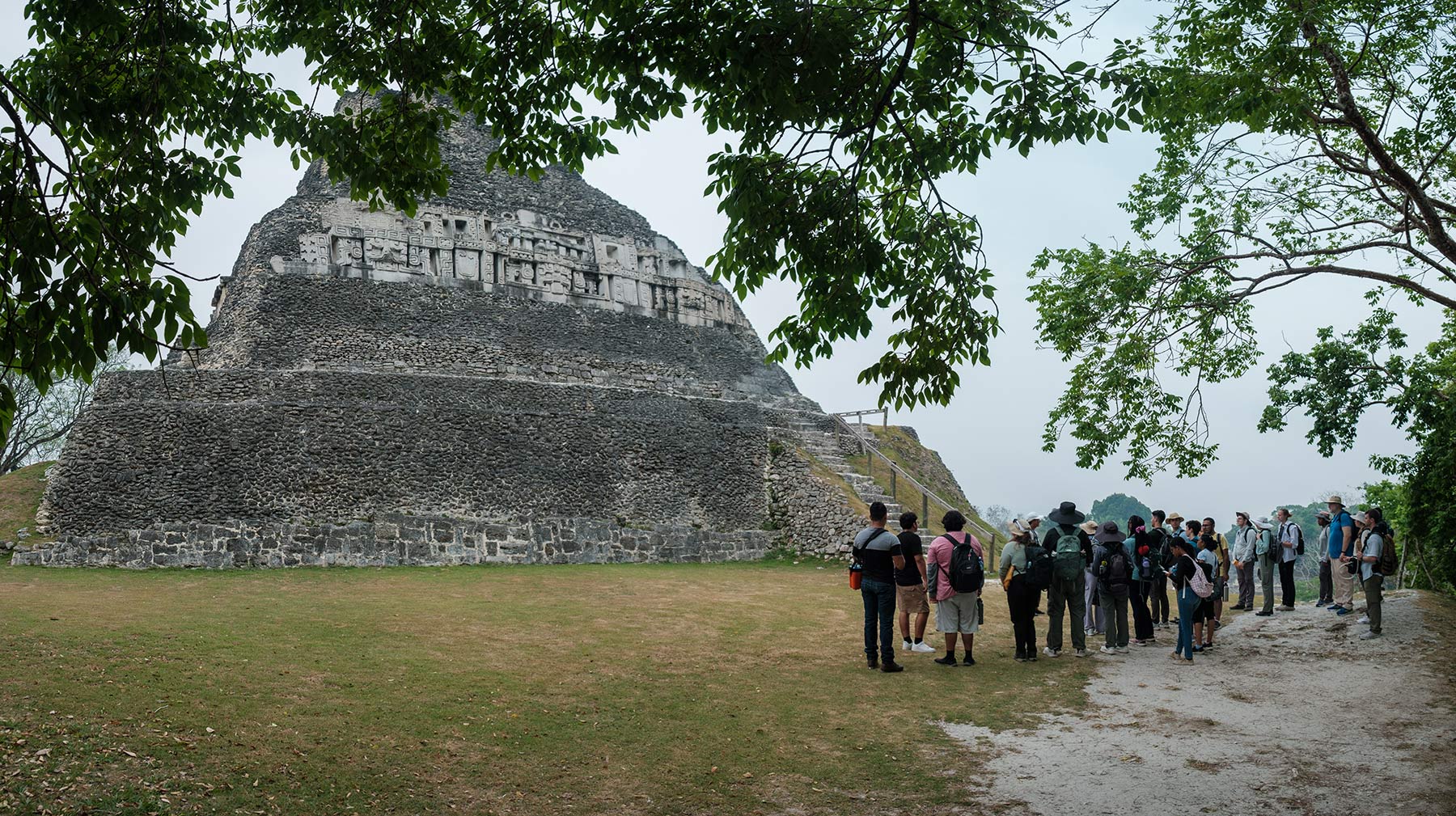 Group of students at the base of a Mayan pyramid