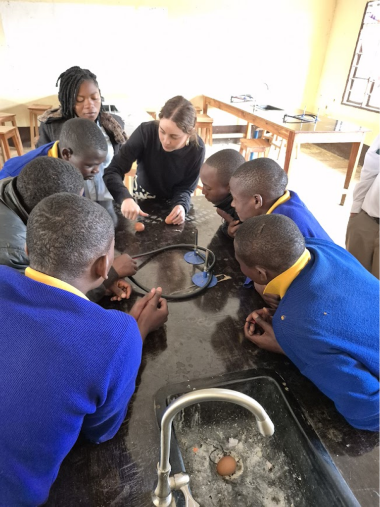 Students working at a table in a classroom