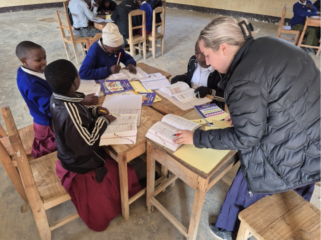 Students sitting at a table with books