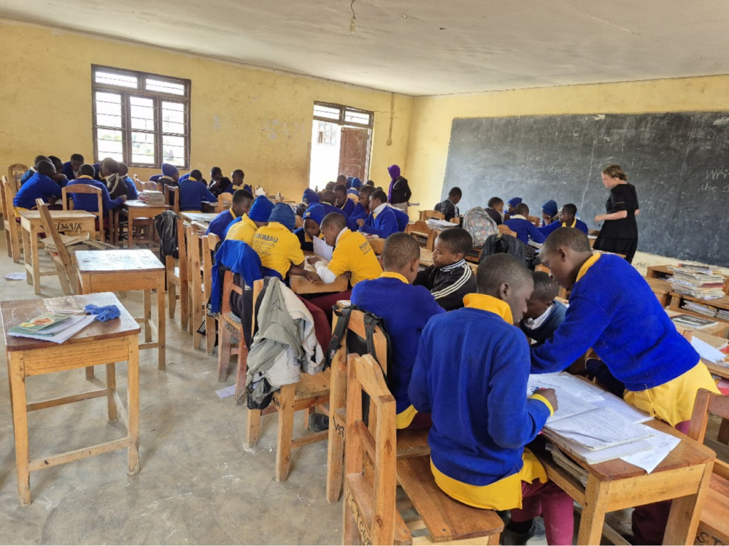 Students working at a table in a classroom